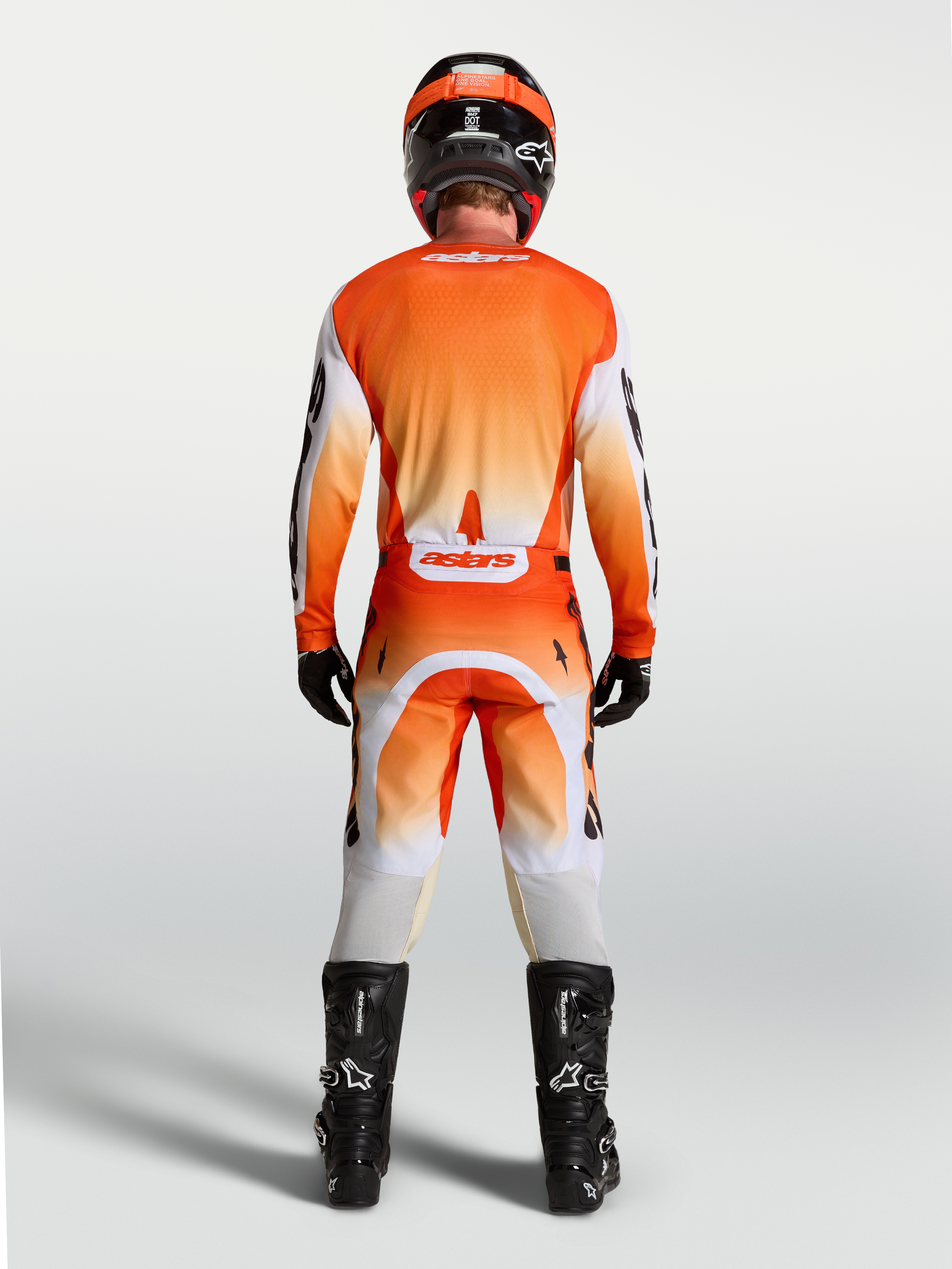 Alpinestars Racer Amber Jersey, rear view on-model, orange and white motocross jersey with breathable race fit.