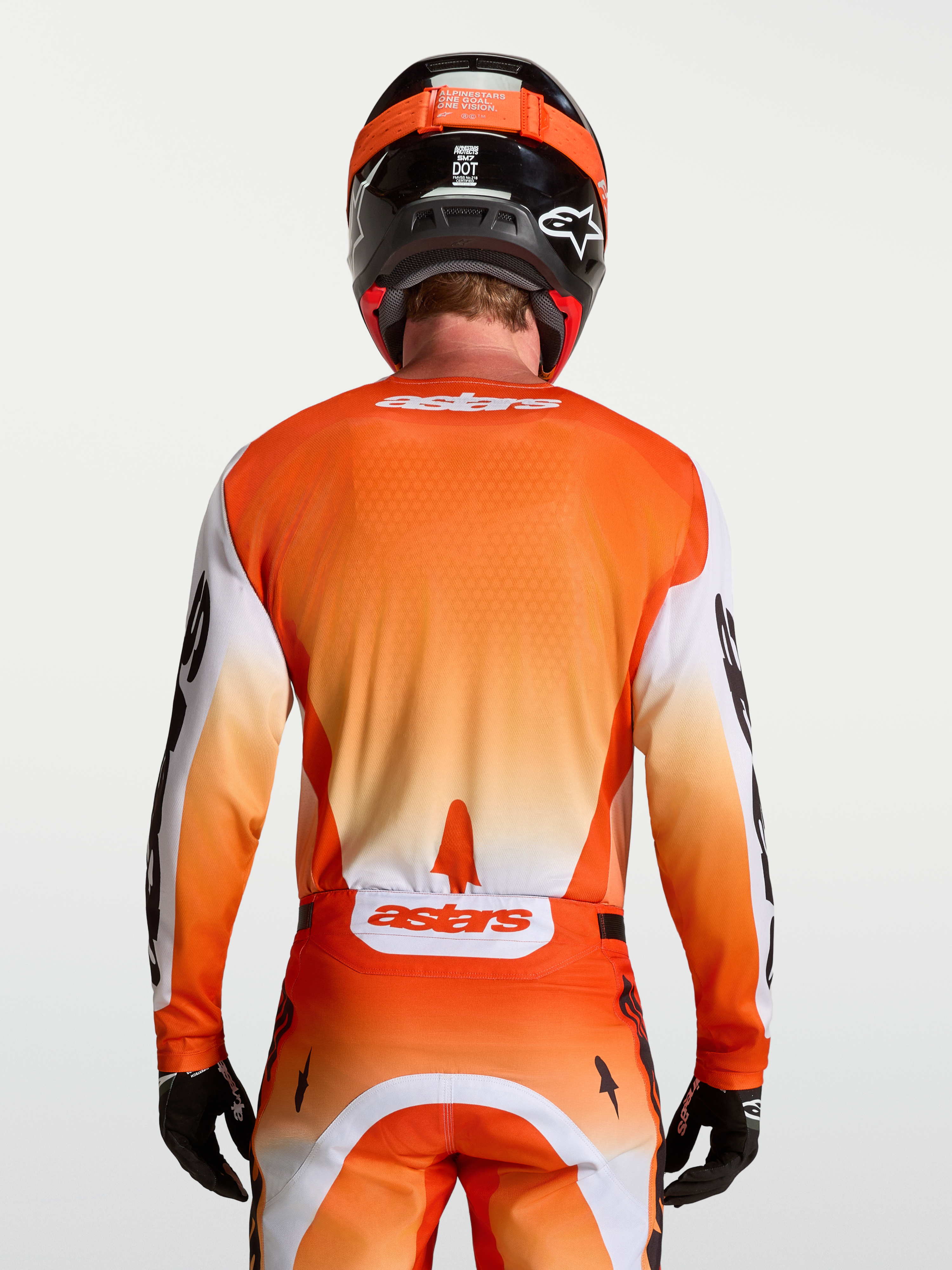 Alpinestars Racer Amber Jersey in orange and white, a breathable, moisture-wicking motocross racing jersey for men.