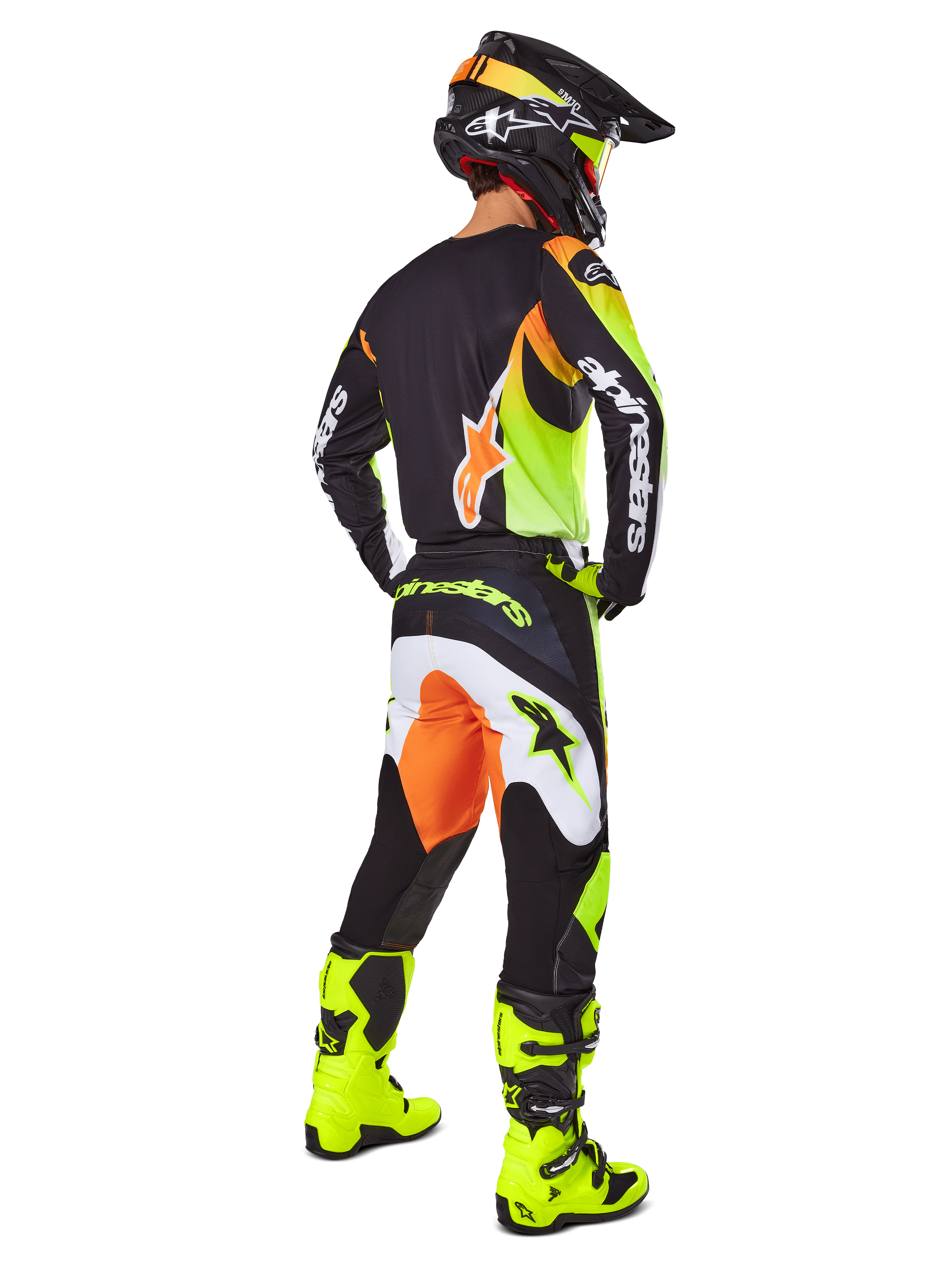 Ensemble d'équipement Alpinestars Fluid Wurx 2025, maillot et pantalon de motocross en jaune, noir et orange, vue de trois-quarts arrière, associé à un casque noir assorti et des bottes jaune vif, équipement de course tout-terrain professionnel.