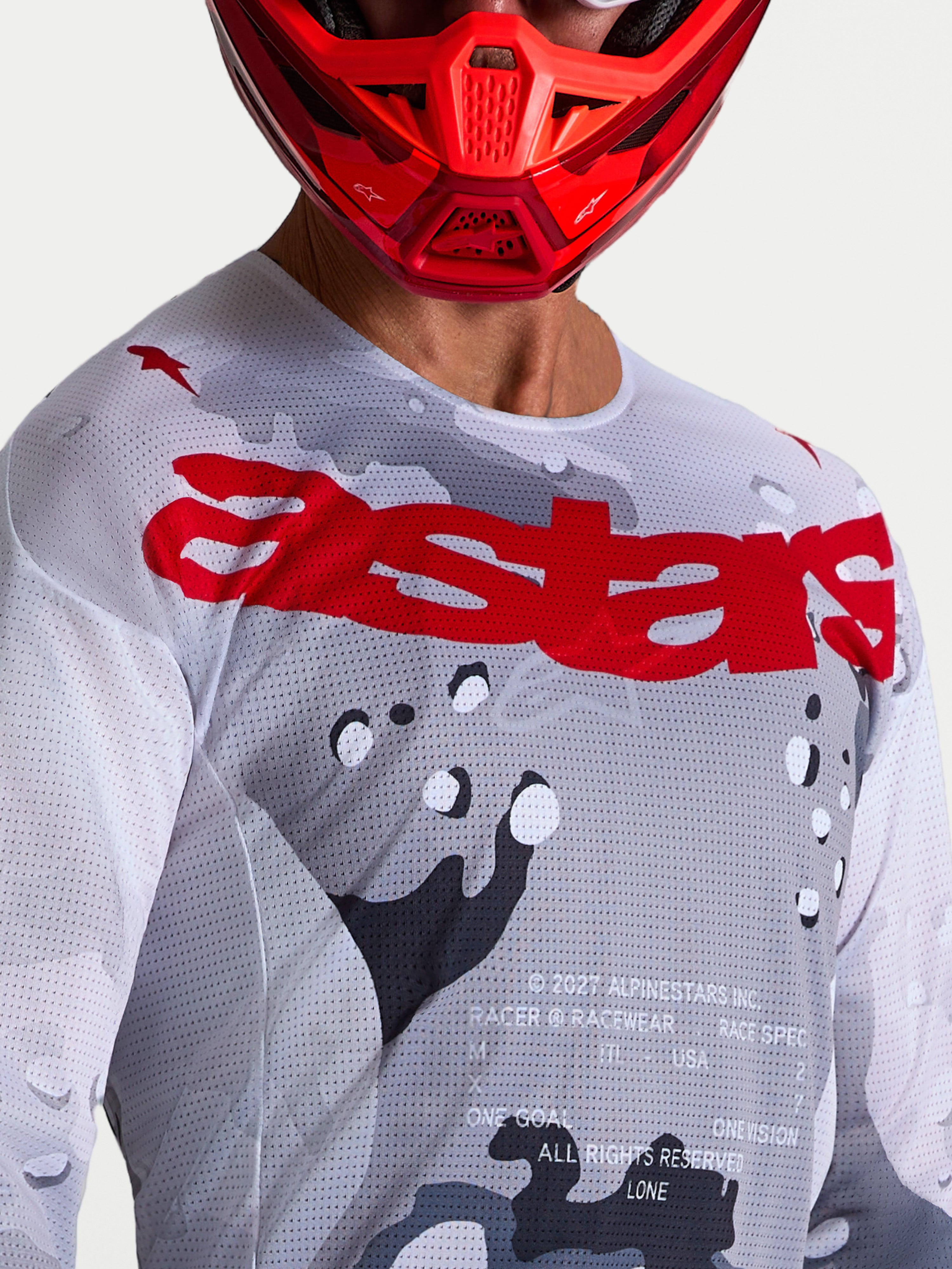 Maillot Alpinestars Racer Air Lone pour homme, gris camouflage et rouge, en mesh aéré pour le motocross.