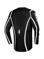 Maillot Alpinestars Fluid Apex 2026, maillot de motocross, noir avec liserés blancs incurvés, vue de dos montrant la coupe ergonomique et un petit logo blanc, maillot haute performance à manches longues pour la course tout-terrain