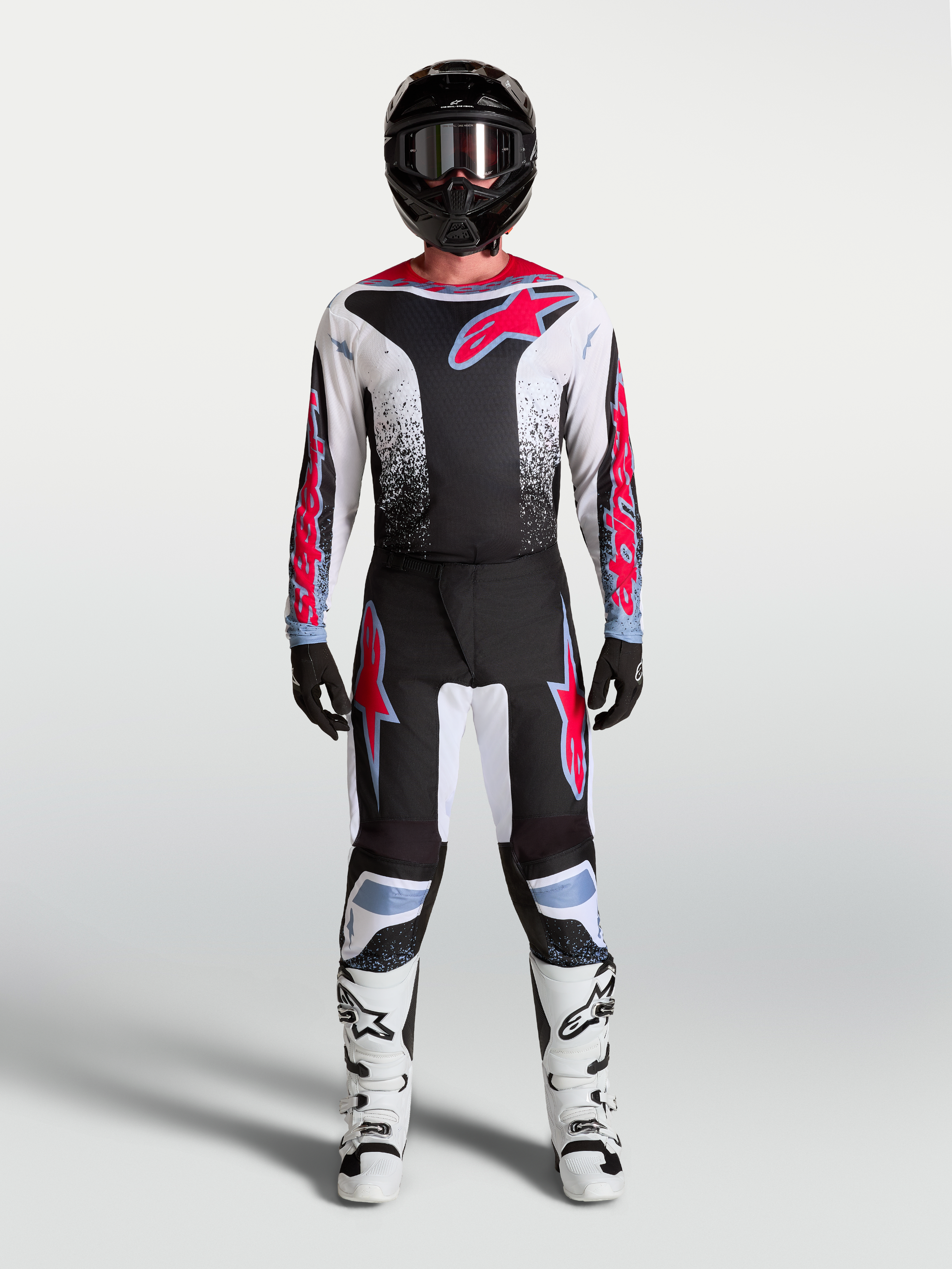 Alpinestars Fluid Drag Jersey and Gear Set, black and white motocross kit with red graphics for off-road performance.
