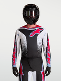 Maillot Fluid Drag Alpinestars, maillot de motocross noir, blanc et rouge fluo pour homme avec graphismes agressifs.