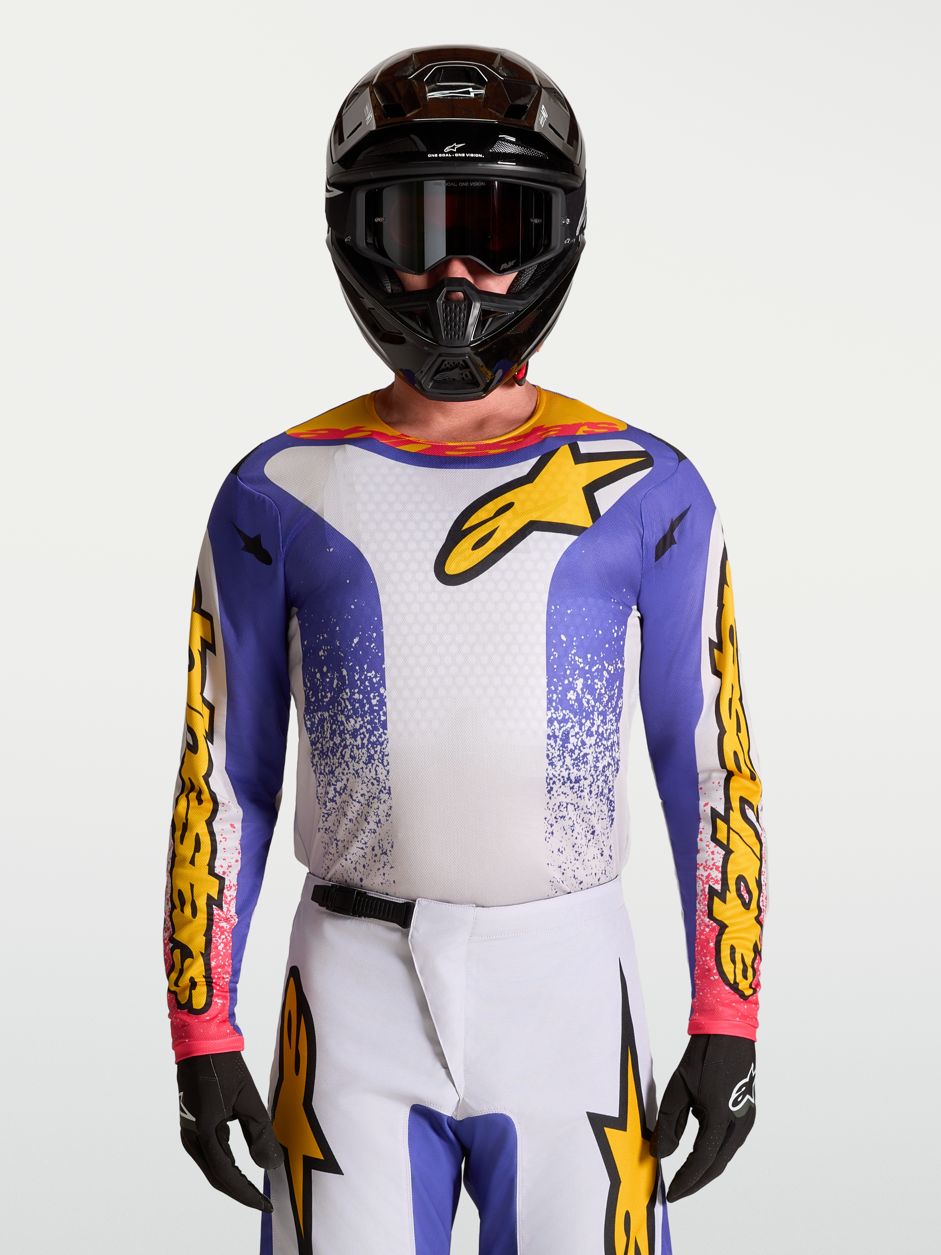 Maillot Fluid Drag d'Alpinestars, maillot de motocross pour homme, bleu iris et doré, tissu technique respirant.