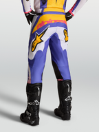 Alpinestars Fluid Drag Pants, Motocross Racing Pants in Blue and Gold, featuring pre-curved legs and reinforced back yoke.