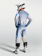 Alpinestars Racer Amber Pants and 2027 Gear Set, motocross racing apparel, gray and blue, rear view on a rider.