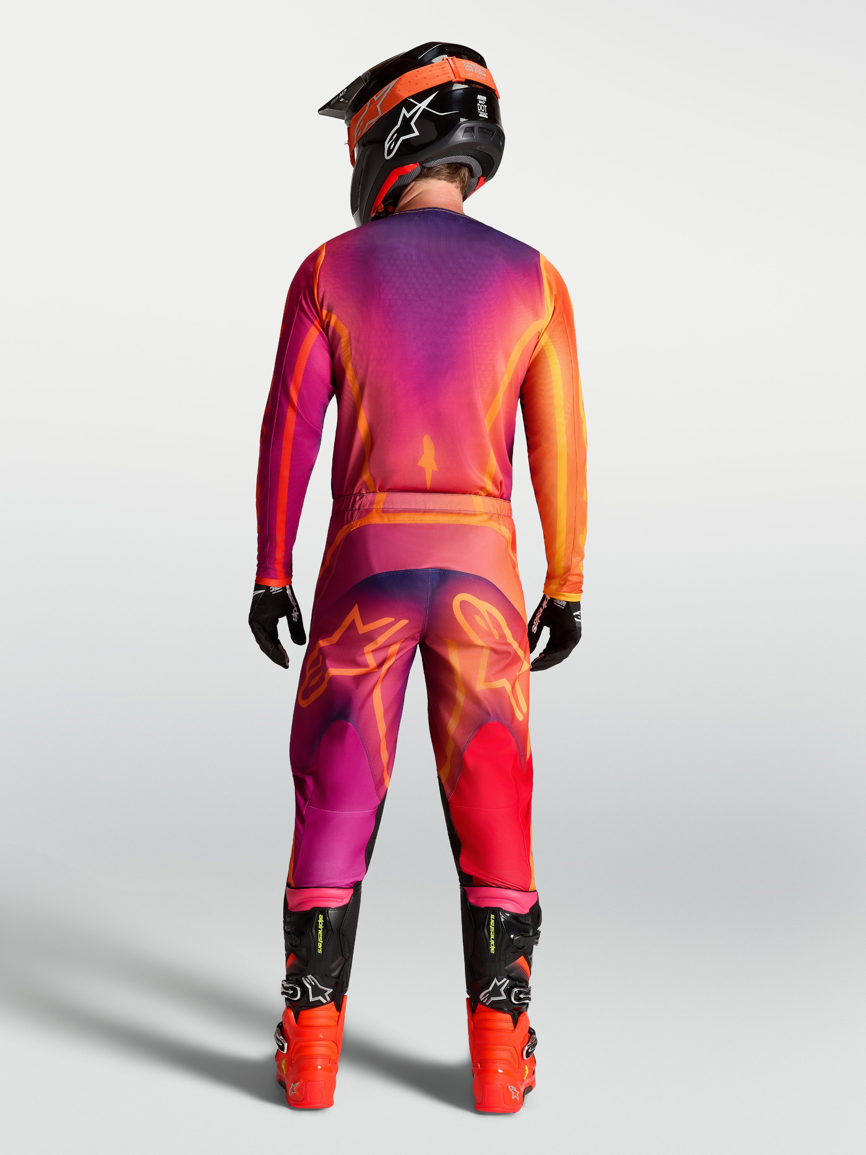 Maillot Alpinestars Fluid Kepler, maillot de motocross pour homme, violet et orange, avec pantalon assorti, vu de dos