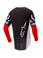 Maillot Alpinestars Techstar Deep Édition Limitée, maillot de motocross, vue arrière, noir et blanc avec manches rouge vif, grand logo Alpinestars blanc au dos, coupe course athlétique en tissu polyester perforé