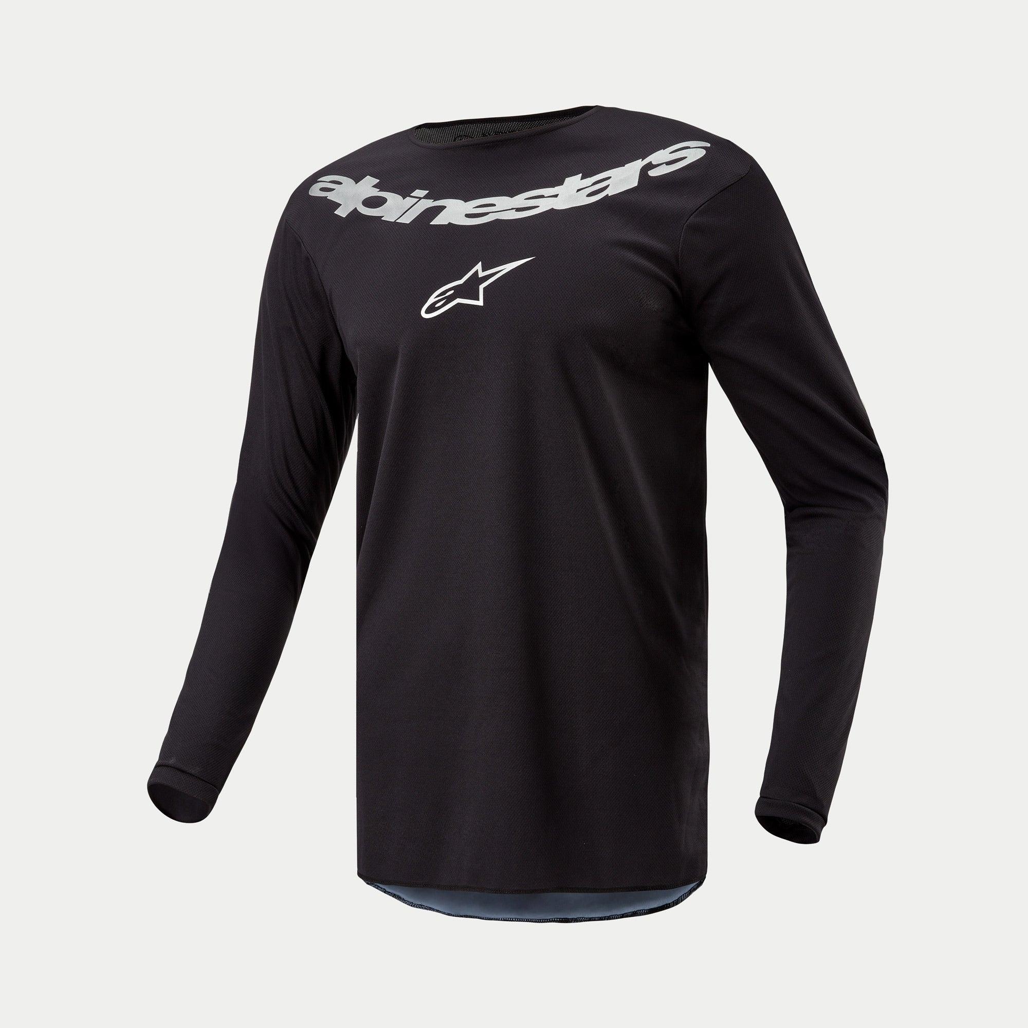 Maillot Alpinestars Fluid Graphite 2024, maillot de motocross, noir et argent, haut de performance à manches longues avec grand logo Alpinestars et étoile argentés sur la poitrine, poly-tissu léger évacuant l'humidité pour la conduite tout-terrain