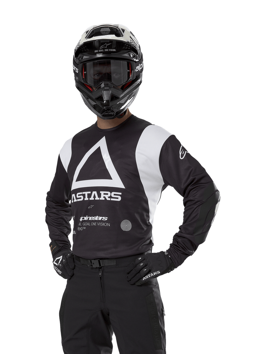 Alpinestars Techdura Jersey, Motocross Jersey, Black and White, worn with matching helmet and gloves, hands on hips pose against white background, featuring large triangle A logo and ASTARS branding