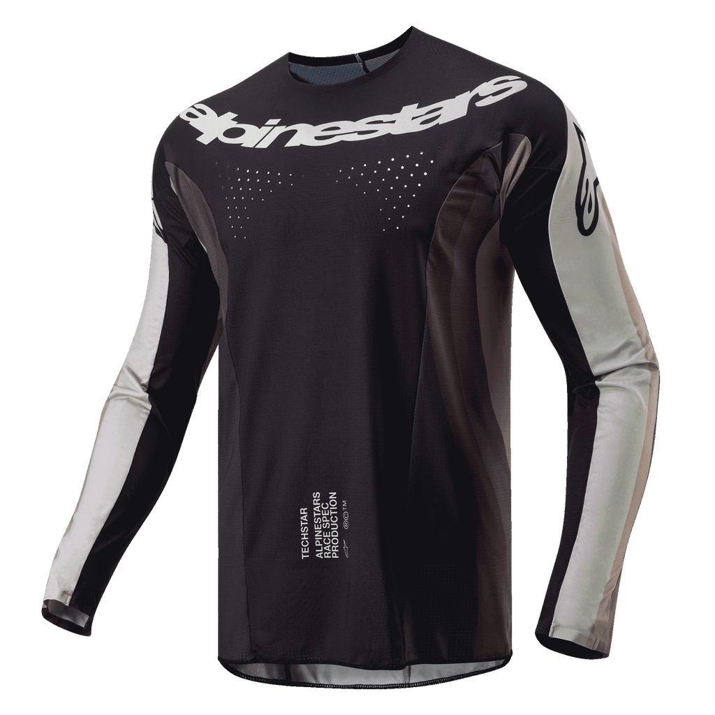 Maillot Alpinestars Techstar Pneuma 2024, maillot de motocross, sable foncé et gris poussière de fer, corps principal noir avec empiècements gris clair sur les manches, logo Alpinestars blanc sur la poitrine, perforations de ventilation découpées au laser, équipement de pilotage tout-terrain haute performance