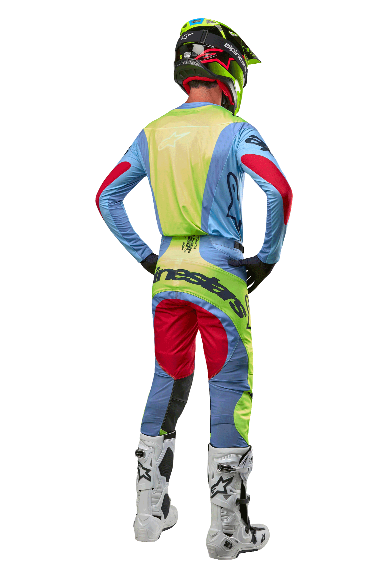 Motocross rider from the back wearing the Alpinestars 2024 Techstar Ocuri Jersey, Light Blue with Yellow Fluo and Red Berry accents, matching racing pants, white boots, and neon helmet, complete off-road gear for professional competition