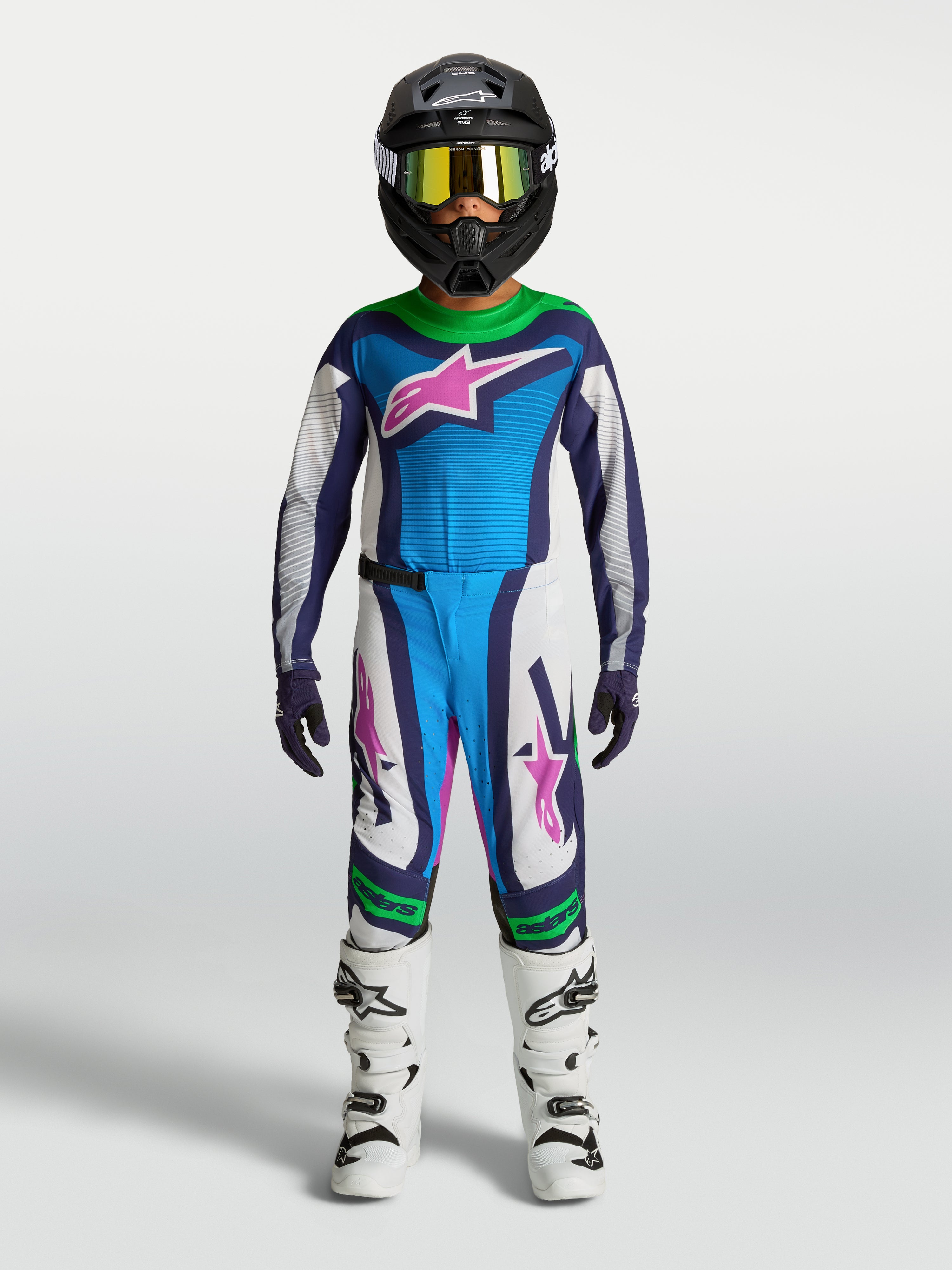 Alpinestars Youth Supertech Maven Gear Set, blue and white motocross outfit with green and pink accents, on-model.