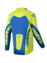 Maillot Alpinestars Junior Racer Veil 2025, maillot de motocross, jaune fluo et bleu, vue arrière présentant des empiècements bleus marqués et le logo Astars sur les manches, coupe allongée à l'arrière pour une meilleure protection, tissu léger évacuant l'humidité pour la course tout-terrain