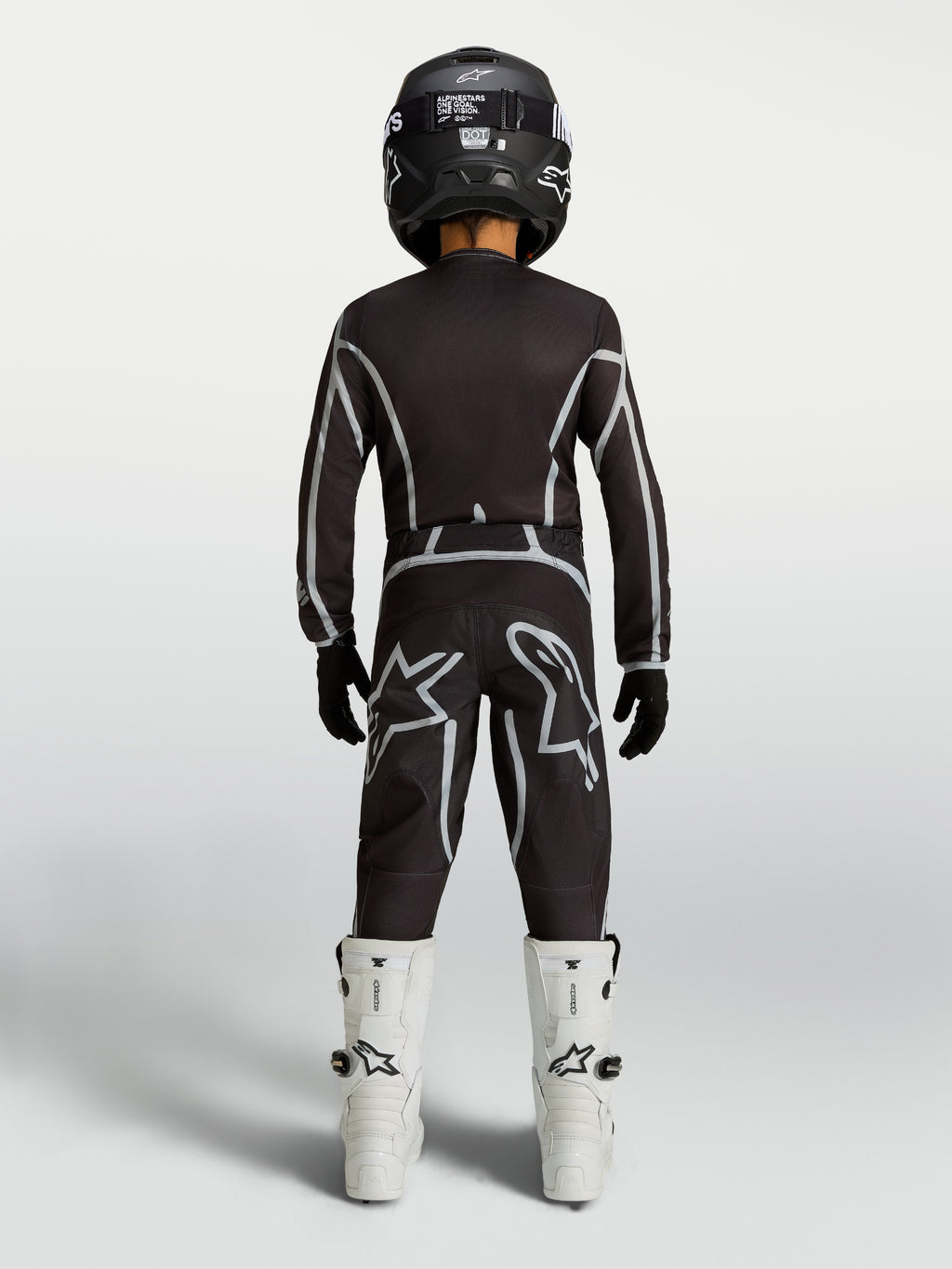 Alpinestars Fluid Apex V2, ensemble de motocross pour junior, noir et argenté, bottes blanches, vue de dos