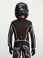 Maillot Alpinestars Fluid Apex V2 Junior, haut de motocross noir et argenté, vue de dos avec coupe ergonomique pour enfant