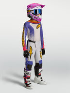 Ensemble Alpinestars Junior Fluid Drag, tenue de motocross enfant, bleu et blanc avec accents roses et dorés, style course.