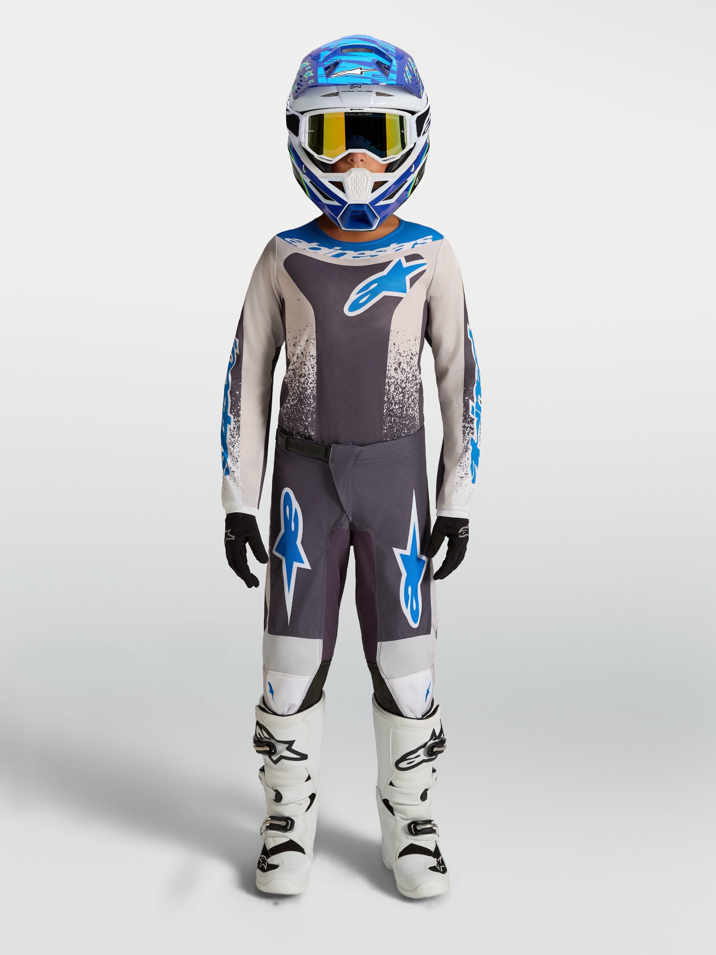 Alpinestars ensemble Fluid Drag Junior 2027, tenue de motocross gris et bleu pour enfant, performance en tout-terrain.