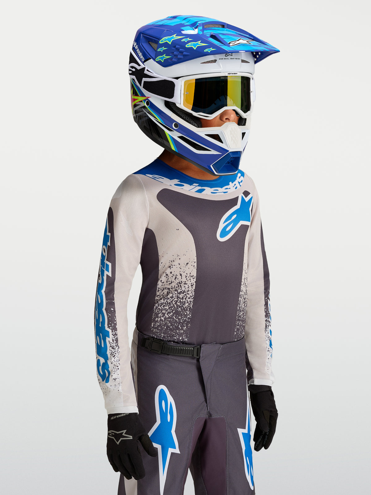 Maillot Fluid Drag Junior 2027 d'Alpinestars, maillot de motocross gris et bleu pour enfant, en poly-tissu léger et respirant.