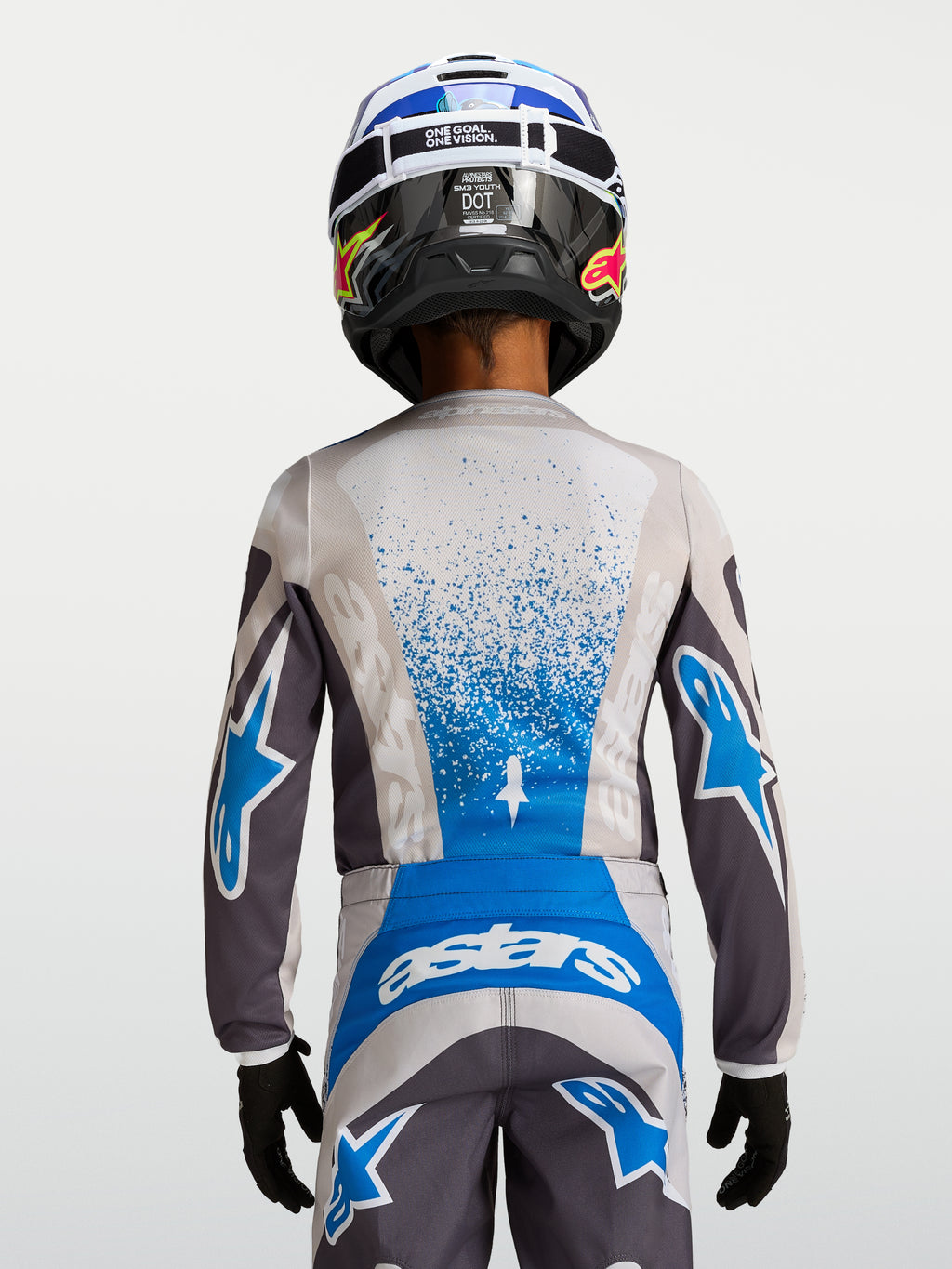 Alpinestars Fluid Drag Junior, maillot de motocross gris et bleu pour enfant, poly-tissu respirant, vue de dos.