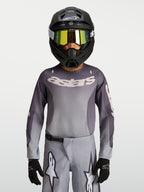 Alpinestars maillot Fluid Amber Junior, maillot de motocross gris et sable respirant pour le tout-terrain.