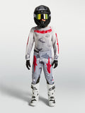 Ensemble Alpinestars Fluid Lone Junior 2027, maillot et pantalon de motocross gris camouflage et rouge pour le tout-terrain.