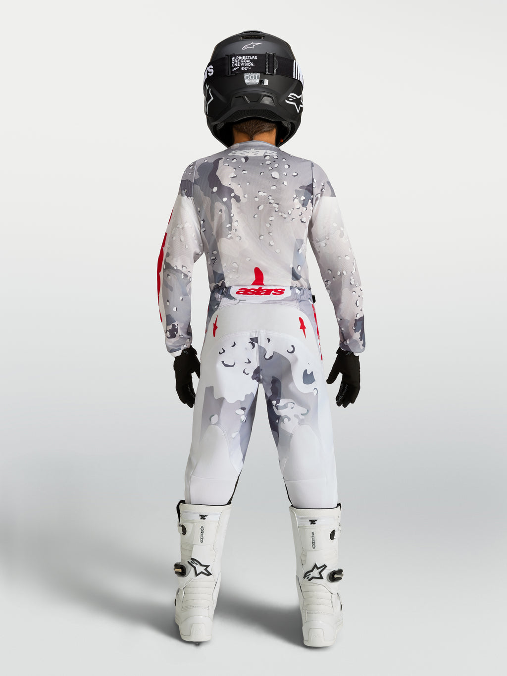Alpinestars maillot et ensemble Fluid Lone Junior 2027, équipement de motocross gris et blanc, accents rouge feu, vue de dos.