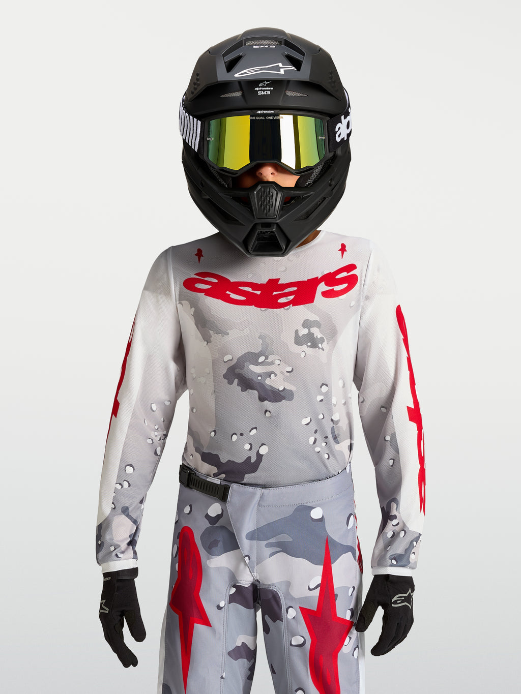 Maillot Fluid Lone Junior 2027 Alpinestars, maillot de motocross gris camouflage et rouge, textile respirant pour enfant.