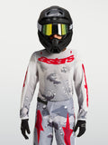 Maillot Fluid Lone Junior 2027 Alpinestars, maillot de motocross gris camouflage et rouge, textile respirant pour enfant.
