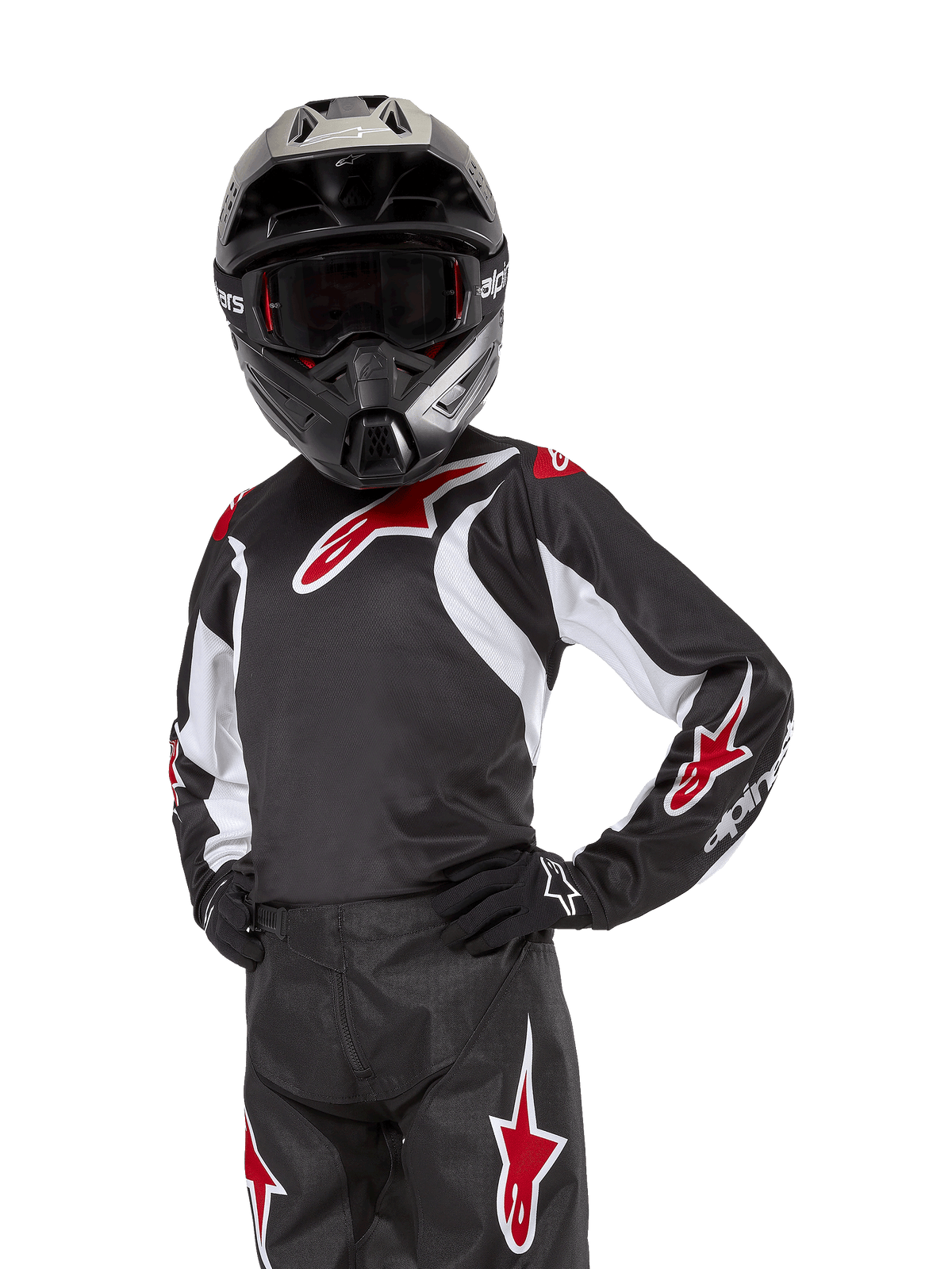 Maillot Racer Lucent Junior 2024, maillot de motocross, noir, blanc et rouge, porté par un jeune pilote avec un casque noir et un pantalon assorti, arborant des logos d'étoiles rouges et des accents graphiques blancs, équipement de performance tout-terrain pour la course de motocross