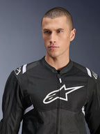 Alpinestars T-SPS Air V2 Jacket, Textile Motorcycle Jacket, Black and White, featuring large white chest logo and mesh paneling, performance sport fit worn by male model