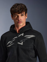 Alpinestars Chrome Superairflow Hoodie, Black motorcycle hoodie, features 3D mesh construction with a large white graphic logo on the chest, worn by a model, urban sport riding apparel with a modern ventilated design