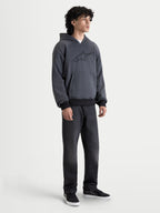 Alpinestars Ageless Hoodie, men's urban motorcycle hoodie in asphalt melange gray, front view on a model wearing casual riding apparel with CE certified shoulder and elbow armor