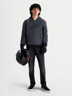 Alpinestars Ageless Hoodie, men's urban motorcycle hoodie in asphalt melange gray, front view on a model wearing black riding gloves and holding a helmet, featuring integrated shoulder and elbow protection.