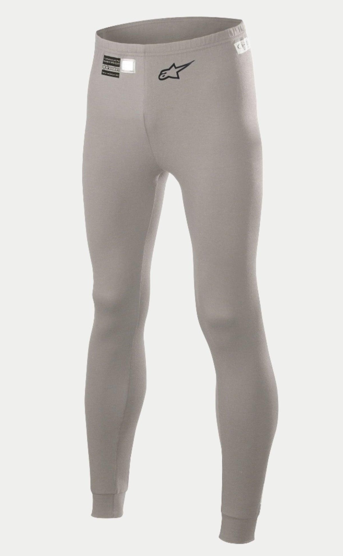 Alpinestars Race V2 Bottom FIA, pantalon de couche de base pour sport automobile, gris moyen, logo étoile noir sur la jambe et étiquette d'homologation FIA à la taille, tissu léger ignifugé avec chevilles resserrées.