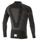 Haut à manches longues Alpinestars ZX Evo V2, sous-vêtement technique pour la course automobile, noir et gris, vue de dos présentant un motif jacquard technique, une construction tubulaire sans couture et une étiquette de certification FIA/SFI à l'ourlet