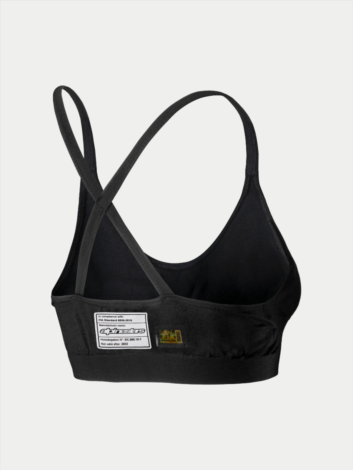 Soutien-gorge Alpinestars Stella TECH ZX, sous-vêtement de course automobile, noir, vue arrière avec étiquette de certification FIA 8856-2018, fines bretelles croisées, matériau léger et ignifuge pour la protection en sport automobile.