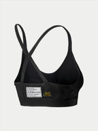 Soutien-gorge Alpinestars Stella TECH ZX, sous-vêtement de course automobile, noir, vue arrière avec étiquette de certification FIA 8856-2018, fines bretelles croisées, matériau léger et ignifuge pour la protection en sport automobile.