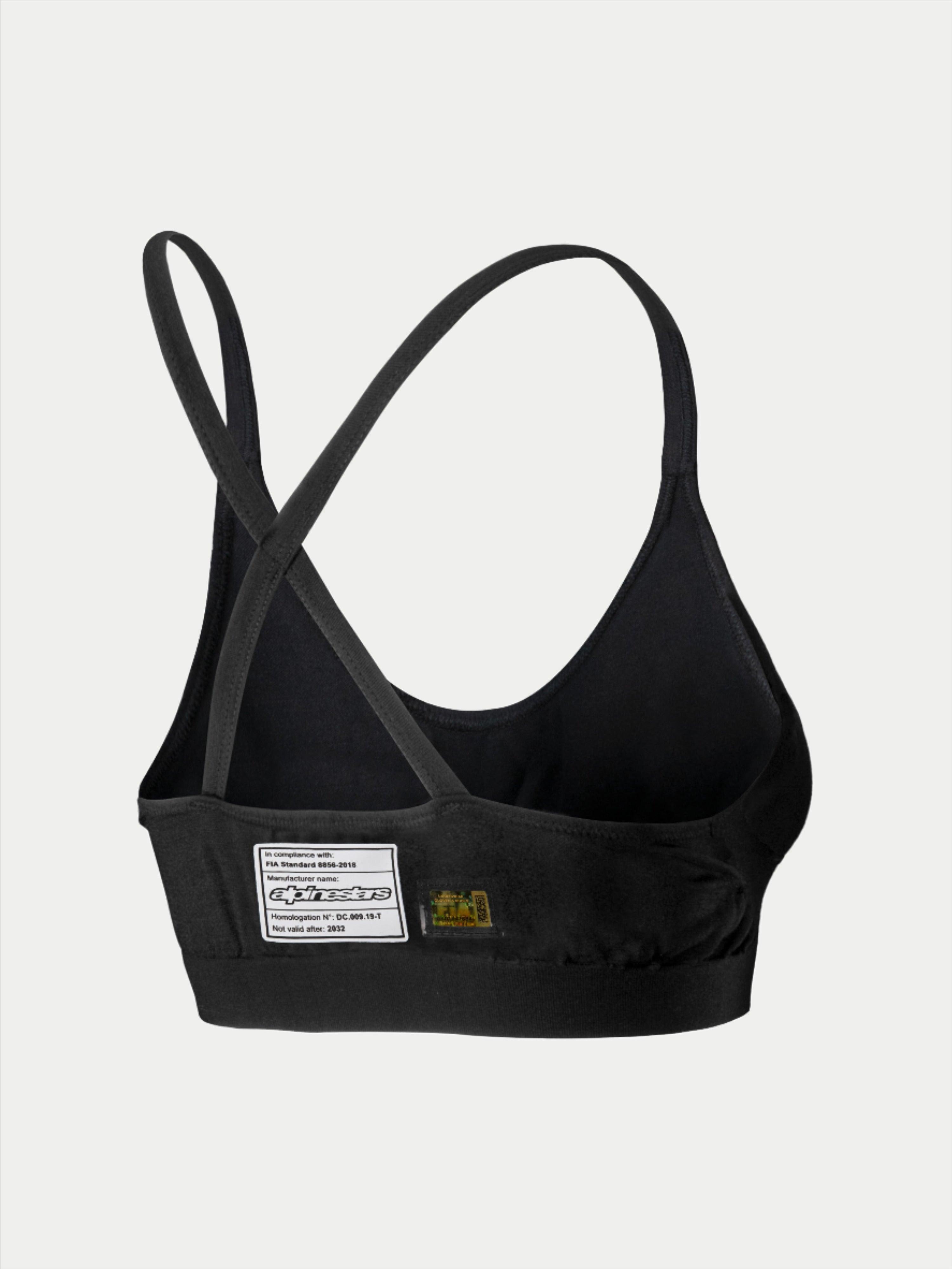 Soutien-gorge Alpinestars Stella TECH ZX, sous-vêtement de course automobile, noir, vue arrière avec étiquette de certification FIA 8856-2018, fines bretelles croisées, matériau léger et ignifuge pour la protection en sport automobile.
