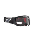 Masque de motocross Alpinestars Supertech Corp, monture noire avec écran clair, bandeau noir réglable avec grand logo étoile Alpinestars blanc, accents intérieurs en mousse rouge, protection oculaire professionnelle pour le tout-terrain