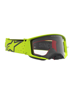 Alpinestars Supertech Vesta, masque de motocross jaune fluo et noir, lentille claire et sangle élastique, équipement off-road.