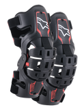 Genouillères Alpinestars Bionic 5S Junior, protection de genou motocross, noir et rouge, paire de protecteurs avec design de cadre hybride et coques ventilées, logo Astar blanc sur la partie supérieure, marquage ASTARS rouge sur la partie inférieure et sangles noires réglables pour un ajustement sûr.
