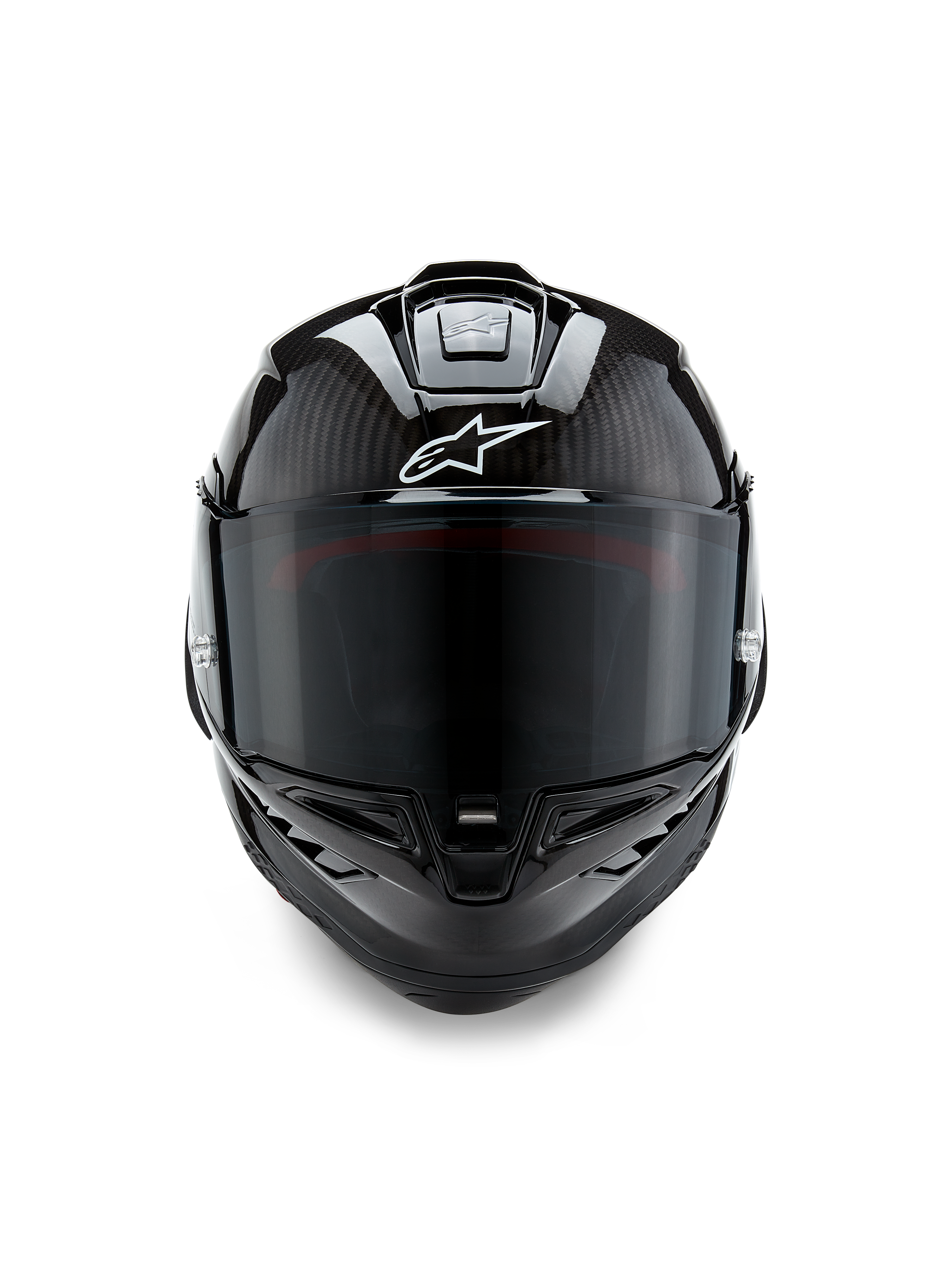 Casque Alpinestars Supertech R10 Solid, vue de face, finition carbone noir mat et brillant, trame de fibre de carbone apparente, logo Alpinestars blanc, écran fumé foncé, casque de moto de course aérodynamique