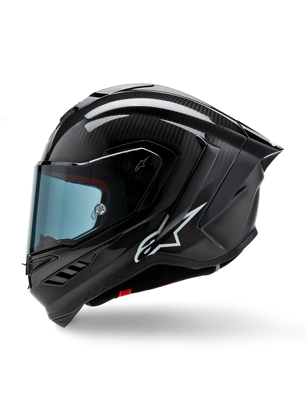 Casque Alpinestars Supertech R10 Solid, casque intégral de course de moto, carbone noir mat et brillant, motif de tissage en fibre de carbone visible, logo Alpinestars blanc sur le côté, design aérodynamique avec aileron arrière intégré et ports de ventilation, vue de profil