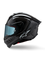 Casque Alpinestars Supertech R10 Solid, casque intégral de course de moto, carbone noir mat et brillant, motif de tissage en fibre de carbone visible, logo Alpinestars blanc sur le côté, design aérodynamique avec aileron arrière intégré et ports de ventilation, vue de profil