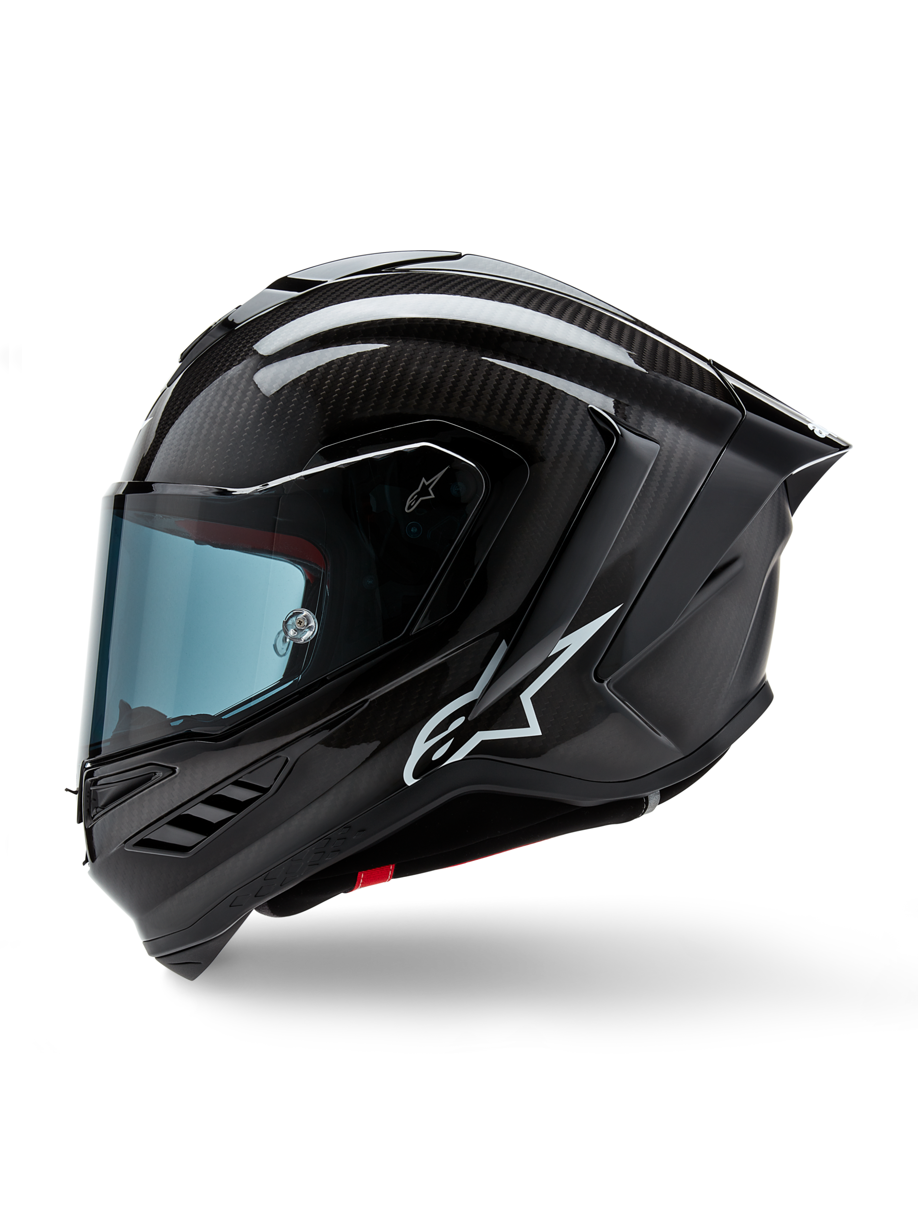 Casque Alpinestars Supertech R10 Solid, casque intégral de course de moto, carbone noir mat et brillant, motif de tissage en fibre de carbone visible, logo Alpinestars blanc sur le côté, design aérodynamique avec aileron arrière intégré et ports de ventilation, vue de profil