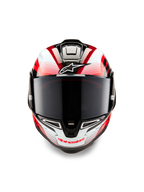 Casque Alpinestars Supertech R10 Team, vue de face, noir carbone, rouge et blanc brillant, avec écran fumé foncé, logo Astar blanc sur le front, marquage Alpinestars rouge sur la mentonnière, design aérodynamique prêt pour la course avec graphismes complexes
