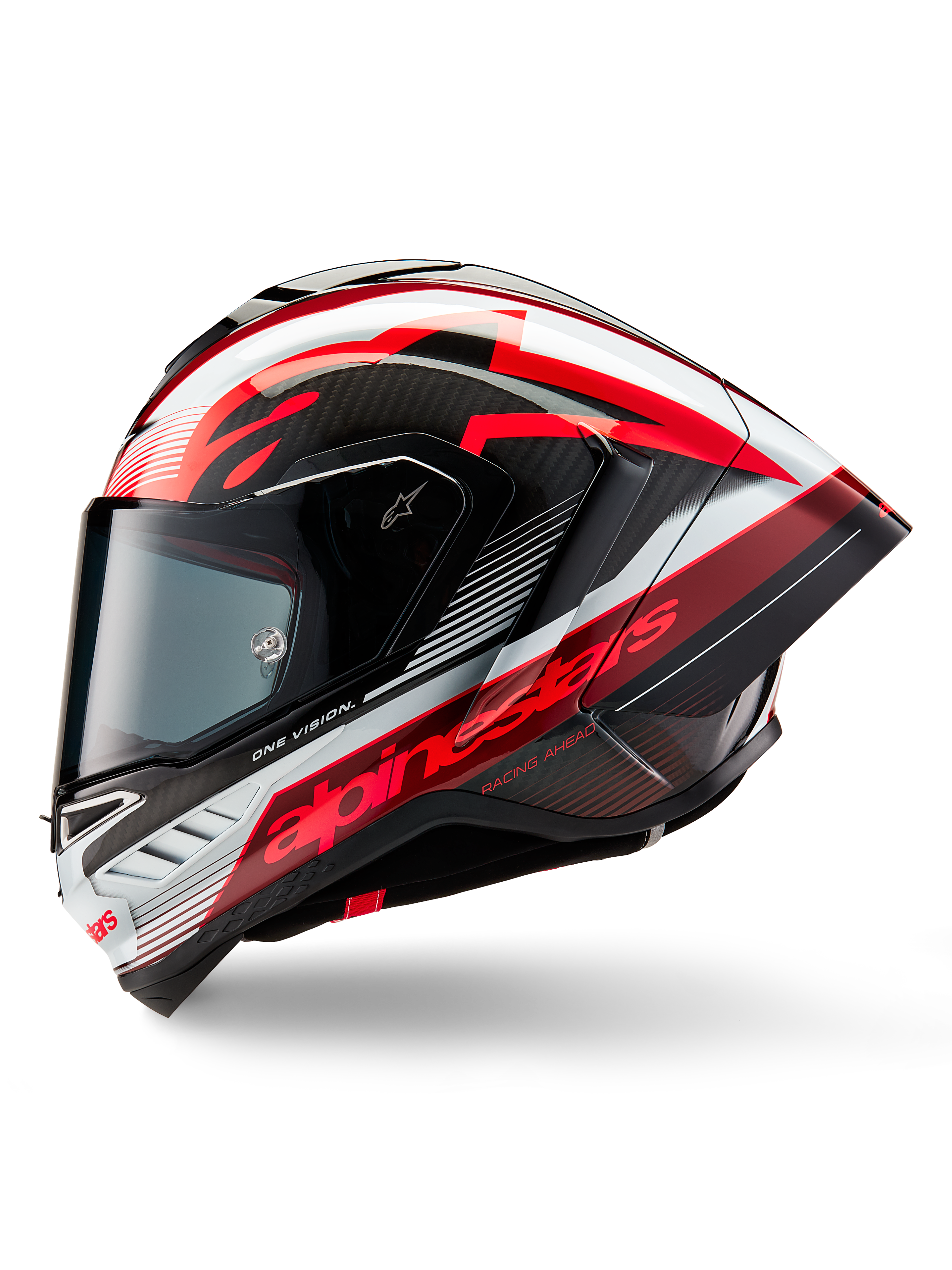Casque Alpinestars Supertech R10 Team, casque intégral de course de moto, finition brillante Noir Carbone Rouge et Blanc, profil latéral montrant le design aérodynamique, marquage rouge avec les textes 'One Vision' et 'Racing Ahead', construction élégante en fibre de carbone pour des performances professionnelles.