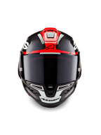 Casque Alpinestars Supertech R10 Element, carbone noir avec graphismes brillants rouge vif et blanc, vue frontale avec visière fumée foncée, texture en fibre de carbone apparente et ventilation intégrée, casque de moto de course professionnel