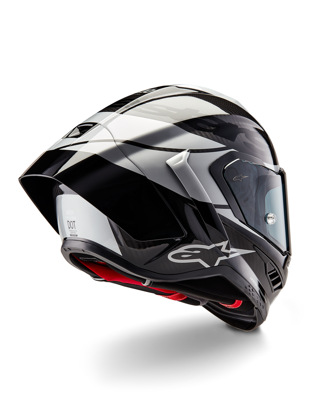Casque Alpinestars Supertech R10 Element, Noir Carbone Argent Noir Brillant, vue de trois-quarts arrière montrant le profil aérodynamique de course, coque en fibre de carbone brillante avec motifs géométriques gris et noirs, logo Alpinestars et rembourrage intérieur rouge